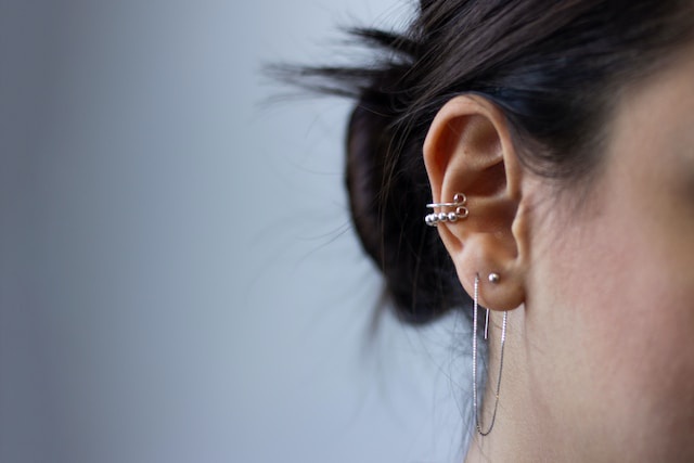What are the most important precautions to take before ear piercing