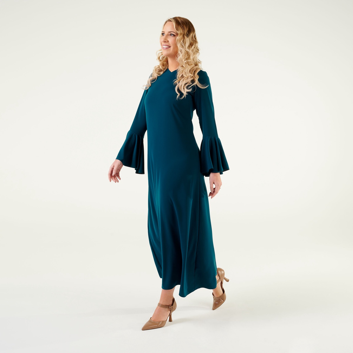 Sculpting Elegance: Long Sleeve Maxi Dresses with Rounded Clutch"