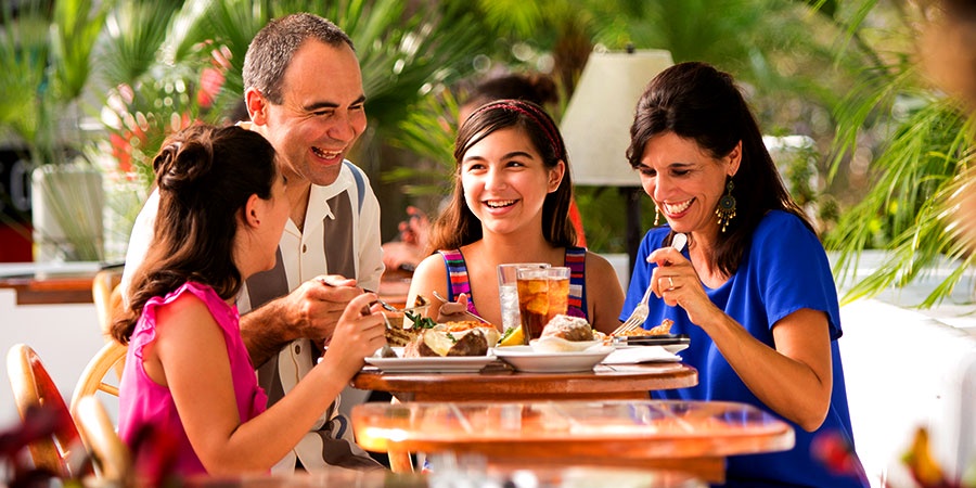 Why do people return to family restaurants with loved ones?