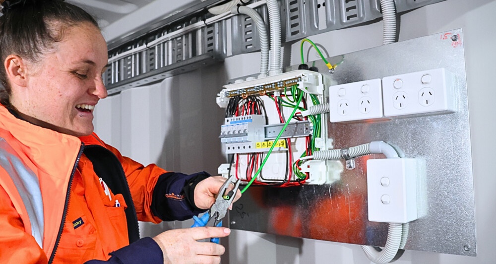 What safety precautions should electricians follow?