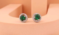 Are there any superstitions or beliefs associated with wearing natural emerald earrings?