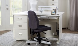 What are the key benefits of a dedicated sewing table?